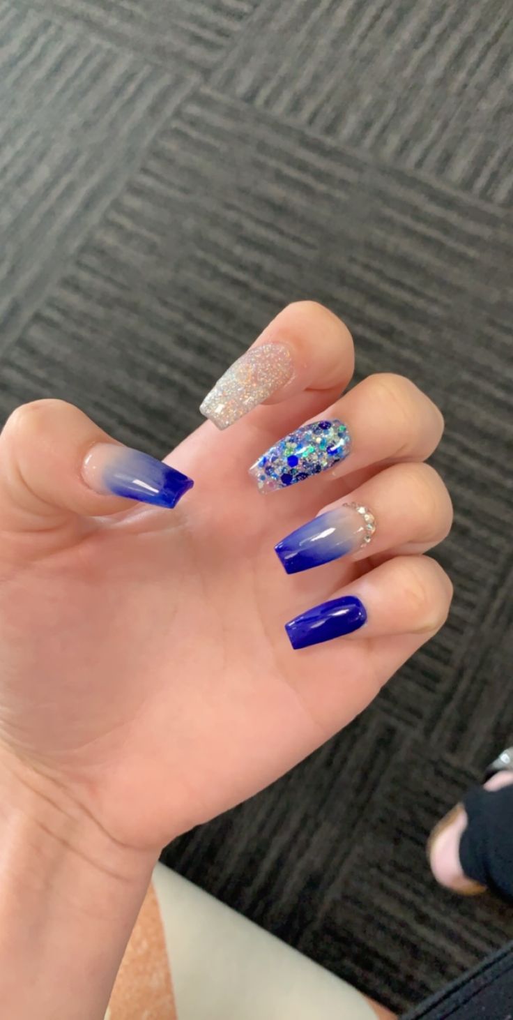 Stunning Blue Gradient Nail Design with Glitter and Rhinestone Accents