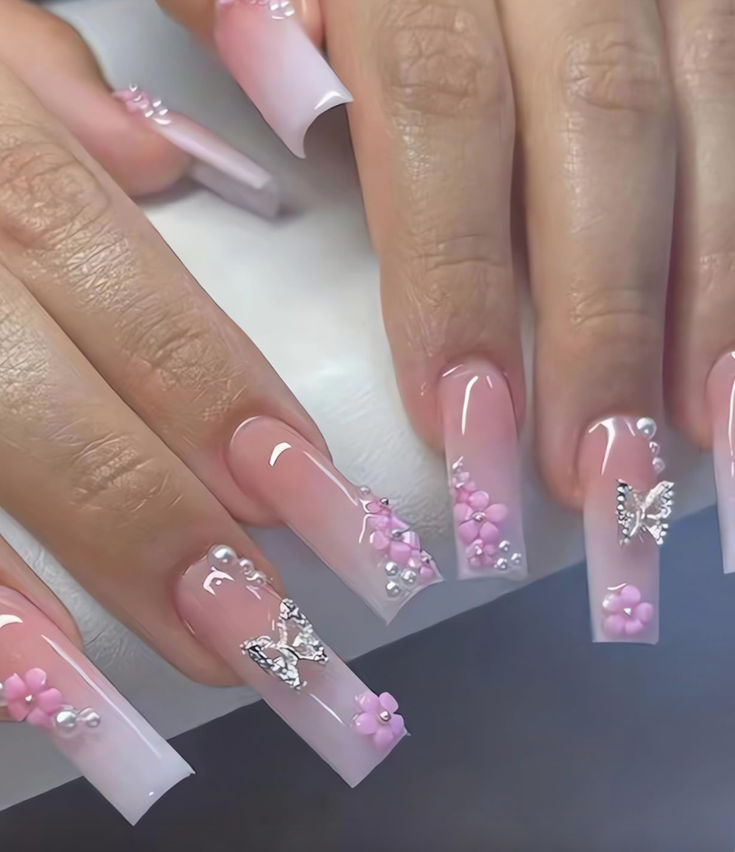 Chic Gradient Pink Ombre Nails with Floral and Butterfly Accents