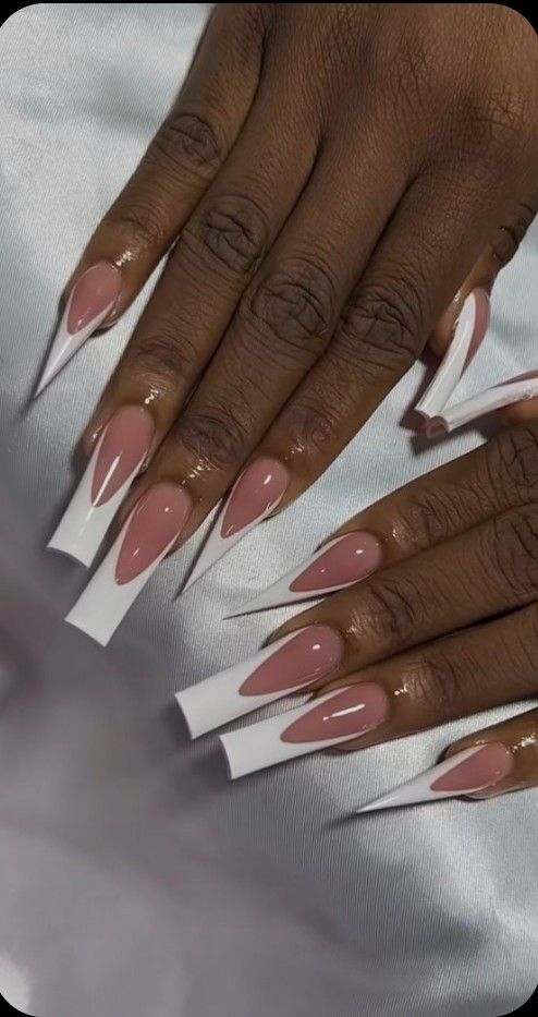 Chic Stiletto Nails: Nude Base with Crisp White Tips for a Modern Look.