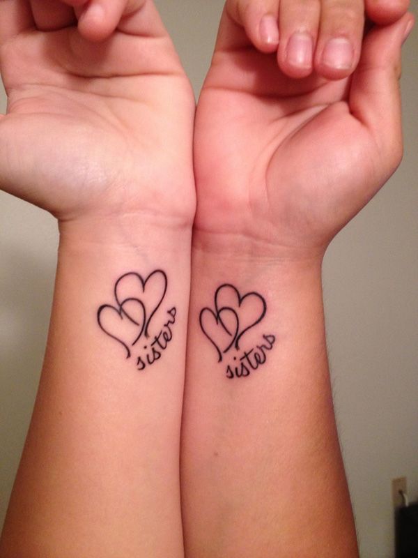 Sisterhood Celebrated: Timeless Heart Tattoo Symbolizing Bond and Unity.