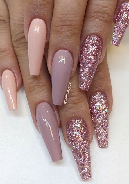 Elegant Nude and Pink Nail Designs with Glamorous Glitter Accents in Stylish Stiletto Shapes.