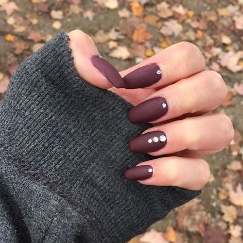 Chic Autumn Elegance: Deep Burgundy Matte Nails with Subtle Rhinestones.