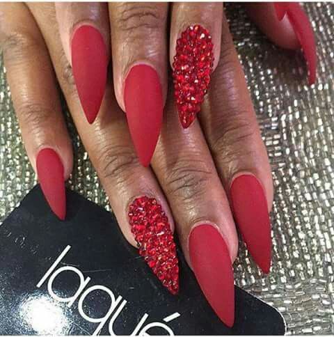 Glamorous Red Matte Stiletto Nails with Sparkling Crystal Accents.