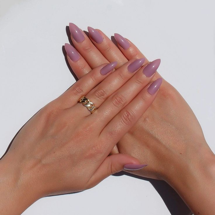 Sophisticated Lavender Almond-Shaped Nails Accented by a Delicate Gold Ring.