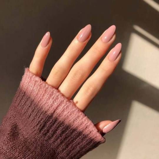 Elegant Soft Almond-Shaped Nude Nails: A Chic Complement to Cozy Knitwear.