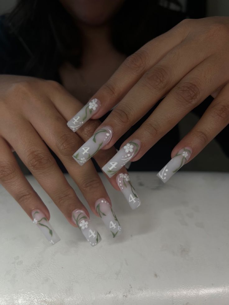 Elegant Pastel Floral Accents on Glossy Square Nails