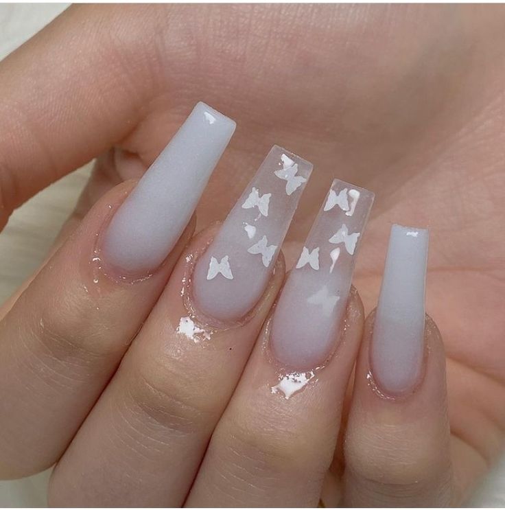 Elegant Ombre Butterfly Nail Art with Intricate Details on Glossy Long Nails.