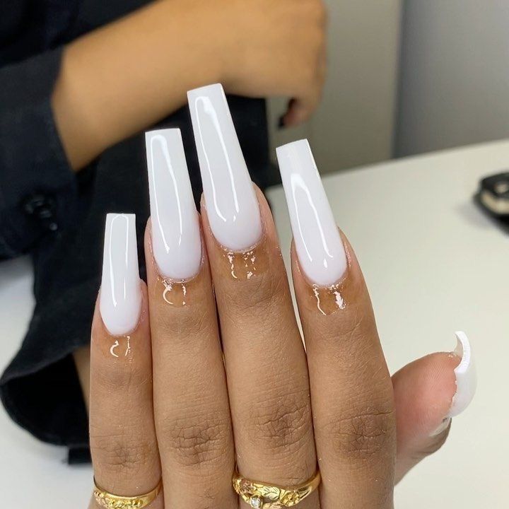 Chic Soft White Acrylic Nails with Glossy Gradient and Clear Accents.