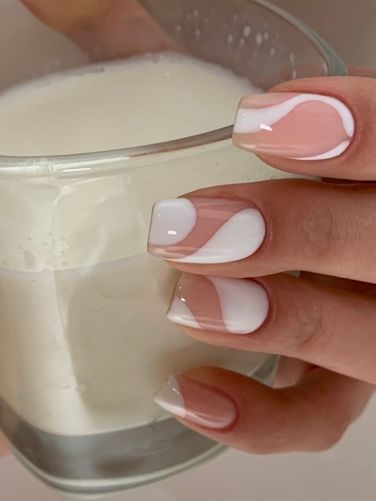 Chic Soft Pink and White Nail Design with Elegant Swirls for Any Occasion