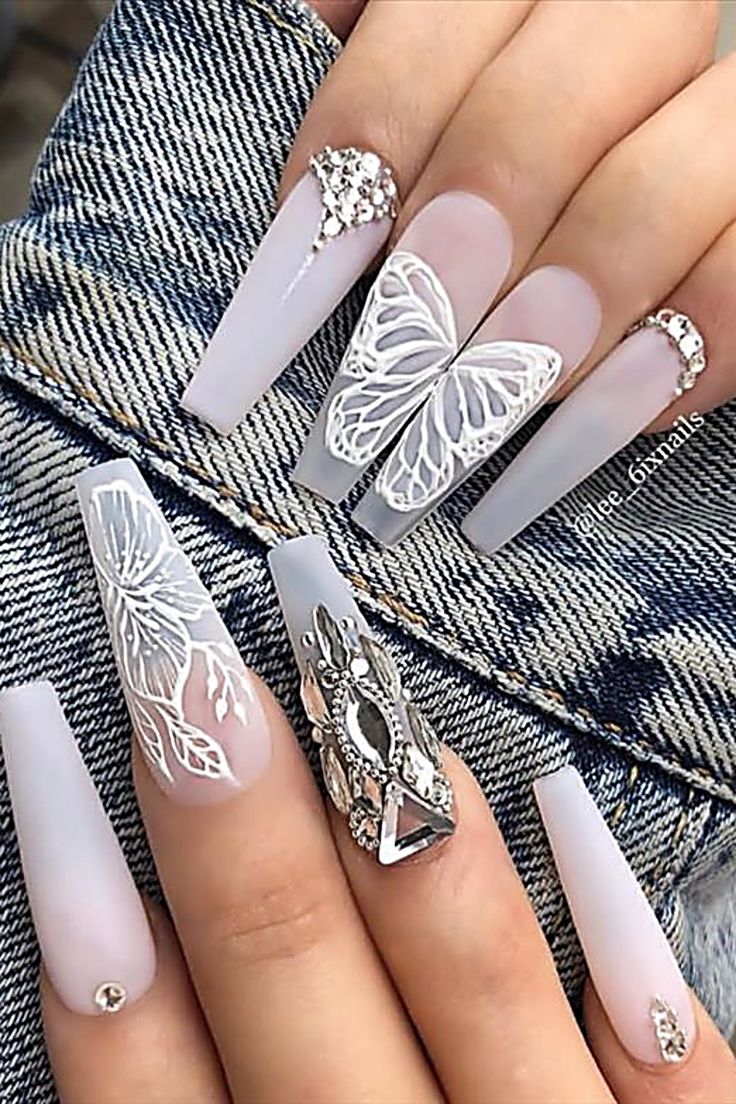 Elegant Long Nail Design with Butterfly and Floral Patterns Enhanced by Matte Finish and Sparkling Rhinestones