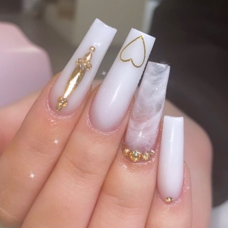 Sophisticated Nail Art: Glossy White Base with Gold Accents and Shimmering Marbled Design.