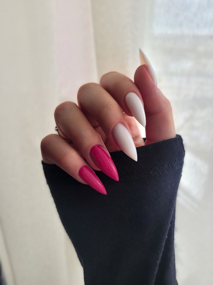 Elegant Stiletto Nail Design: Bold Deep Pink and Classic White Contrast