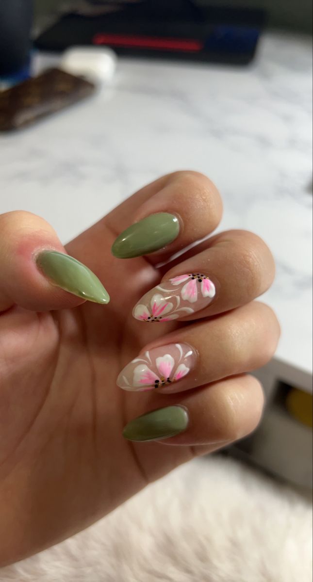 Sophisticated Green and Clear Nail Design with Delicate Floral Accents.