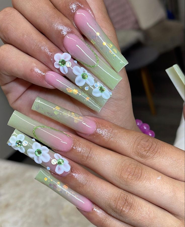 Elegant Floral-Inspired Coffin Nails with Soft Pink Base and Translucent Green Tips.