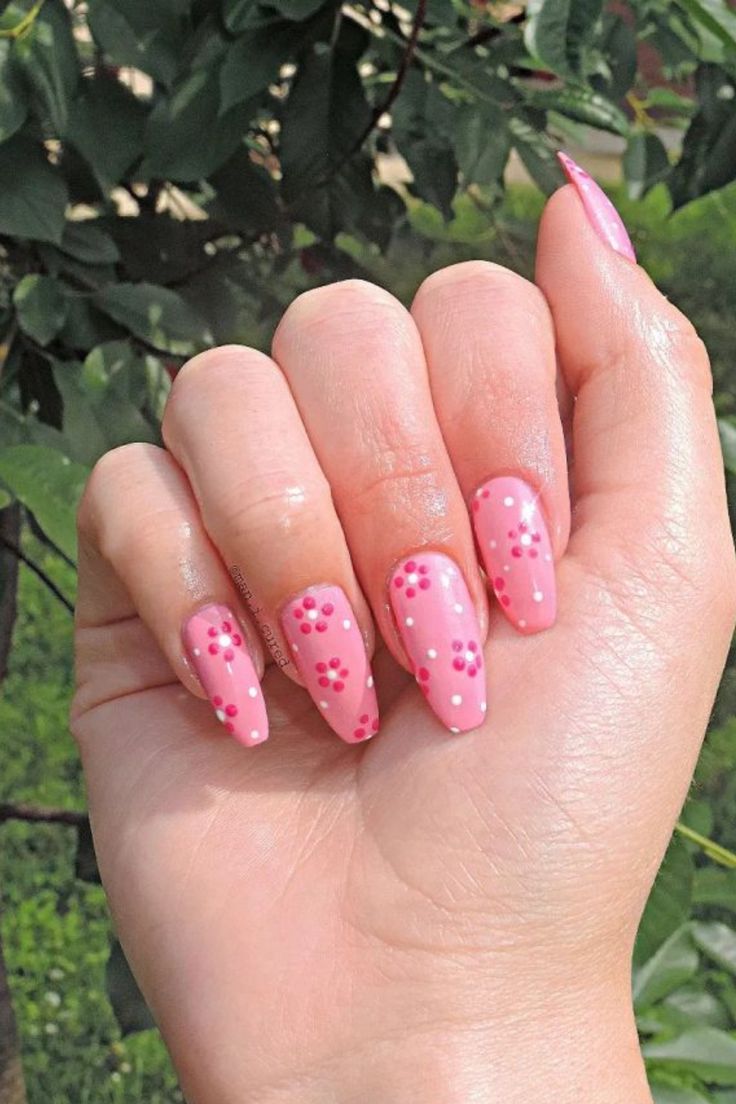 Charming Pink Nail Design with Red Flowers for a Delightful Spring/Summer Aesthetic.