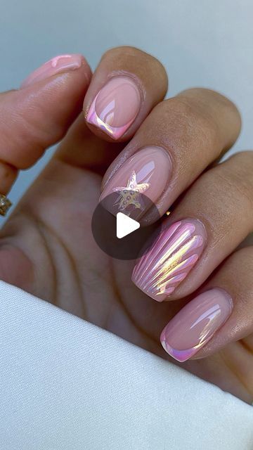 Sophisticated Soft Pink Nail Design with Delicate Gold Accents and Unique Patterns.