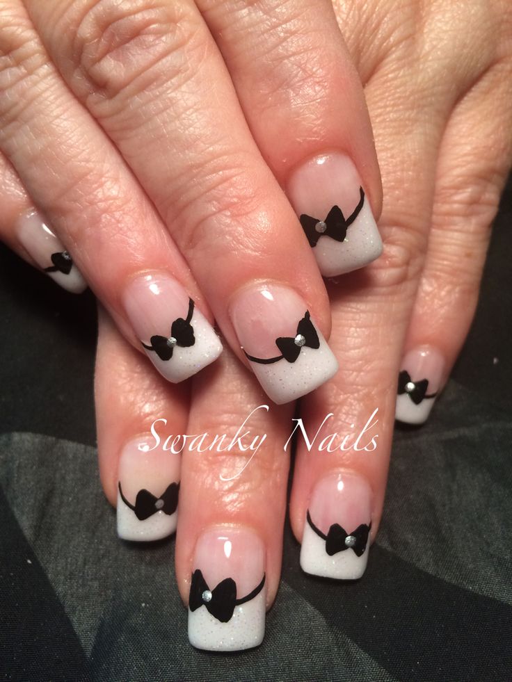 Chic Gradient Nail Design with Playful Black Bows for Any Occasion