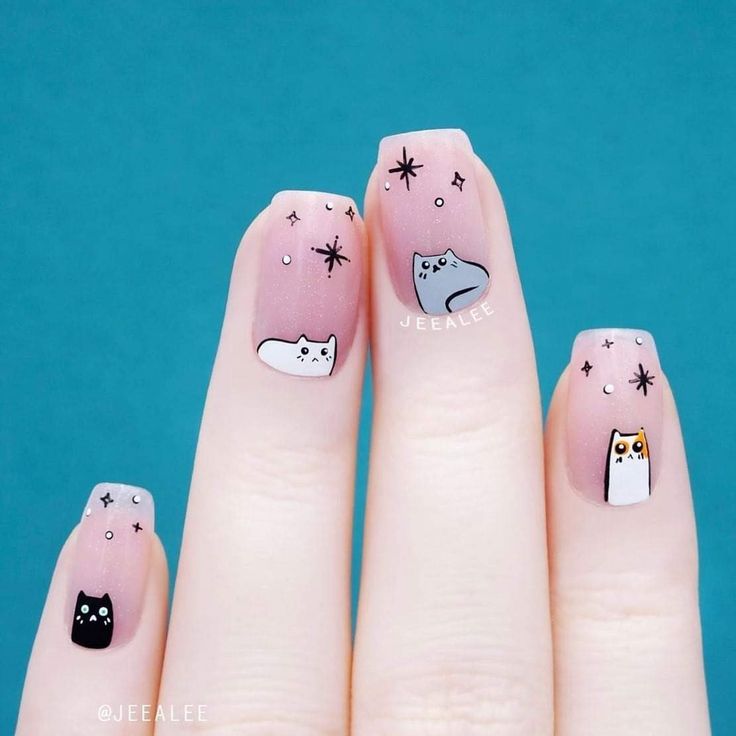 Charming Cat-Themed Nail Art with Ombre Pink and Starry Accents for Animal Lovers.