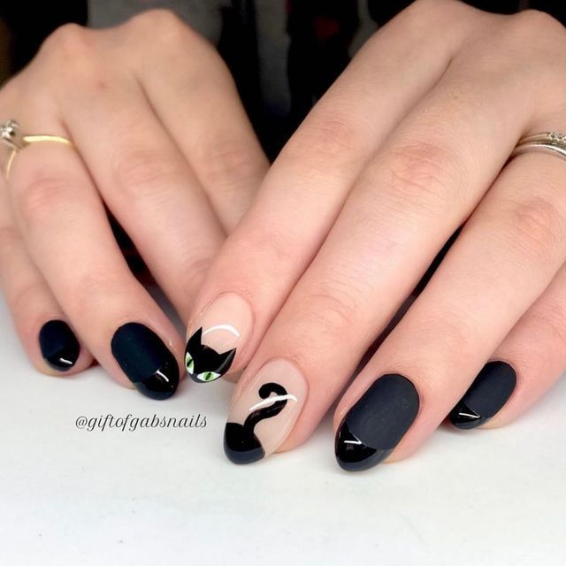 Chic Dark Nail Art Featuring Playful Cat Motif and Whimsical Accents.