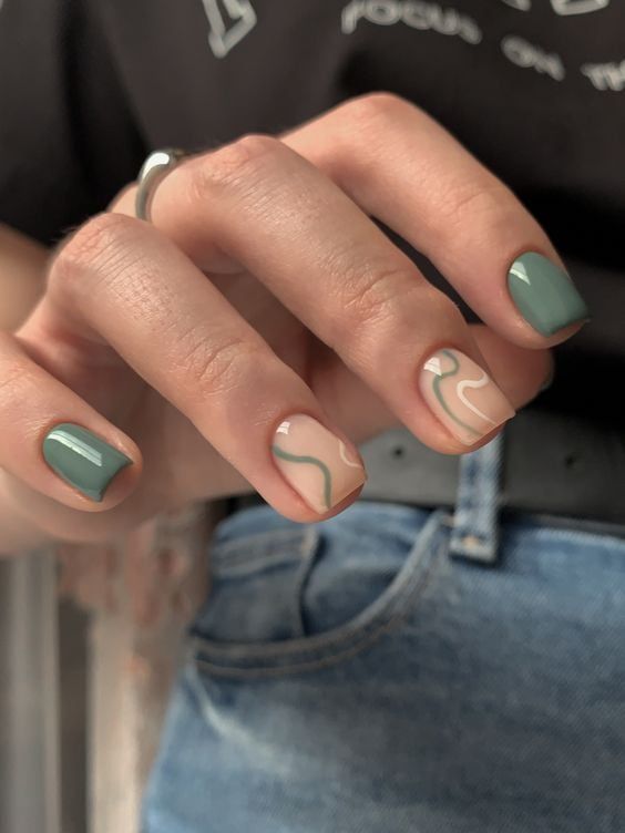 Sleek Nail Art: Muted Green and Neutral Tones with Modern Abstract Design.