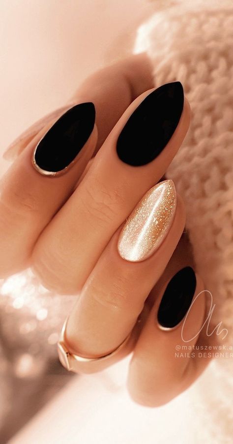 Chic Elegant Nail Design with Glossy Black, Shimmering Gold, and Glittering Accent.