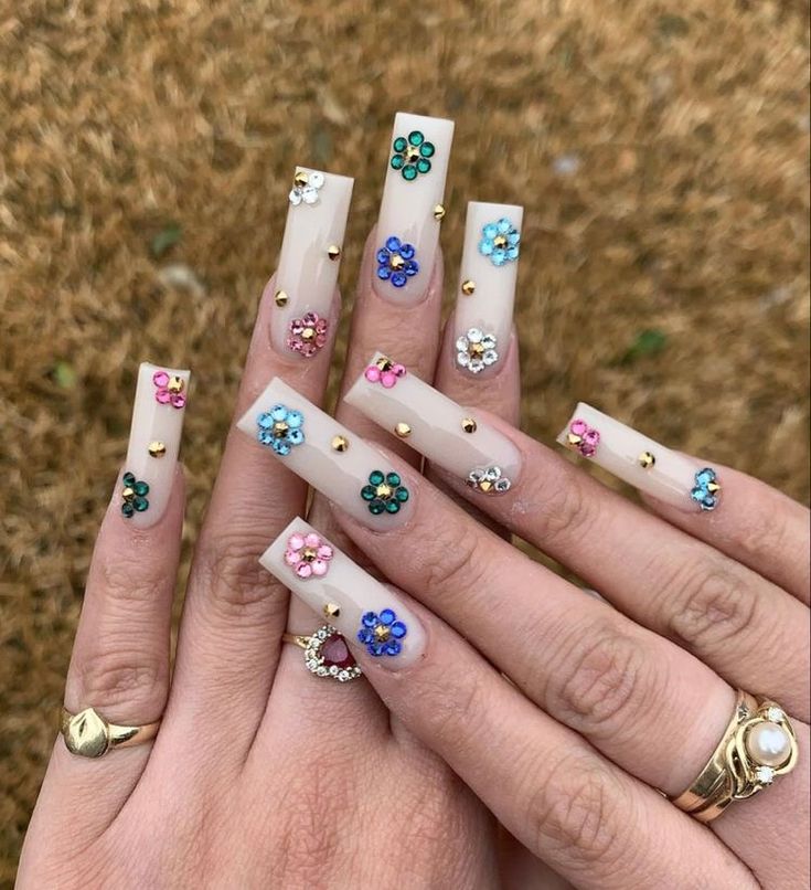 Vibrant Floral Nail Design with Long Square Tips and Glamorous Gold Accents