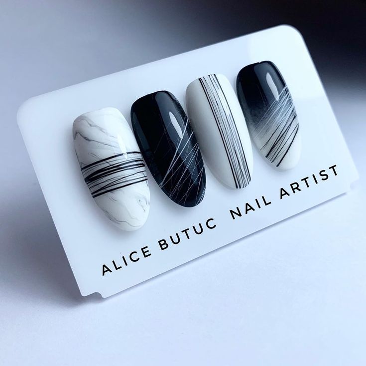 Chic Monochrome Nail Design with Elegant Black, White, and Marble Effects.