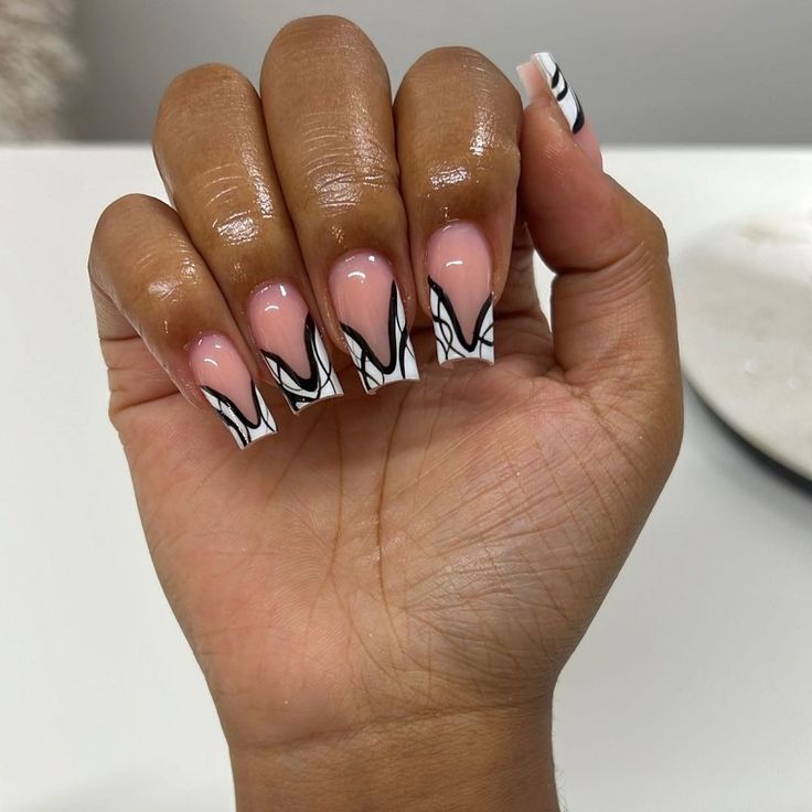 Modern Sophistication: Stylish Acrylic Nails with Soft Pink and Bold Black Designs