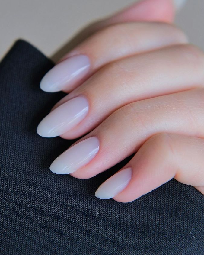 Chic Almond-Shaped Nails with Subtle Ombre Gradient for a Modern Minimalist Aesthetic.