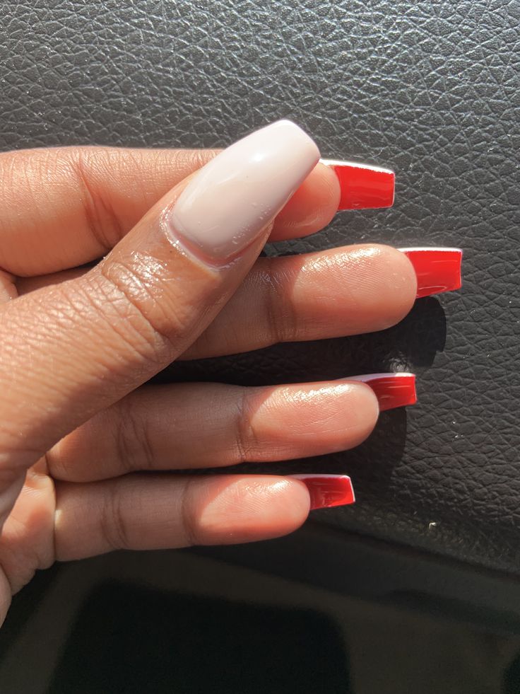 Chic Nude Base with Bold Red Tips: A Striking Nail Design