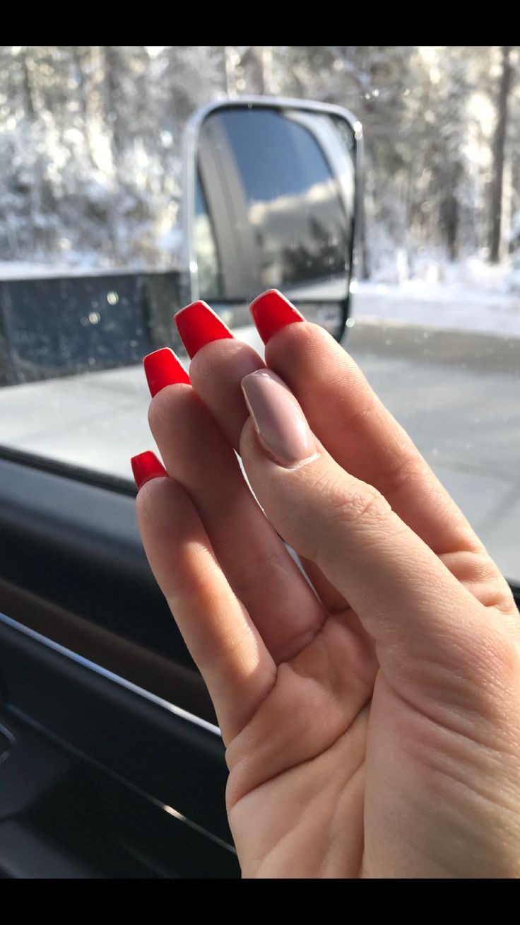 Chic Red-Tipped French Nails: A Modern Statement Design for Any Occasion.