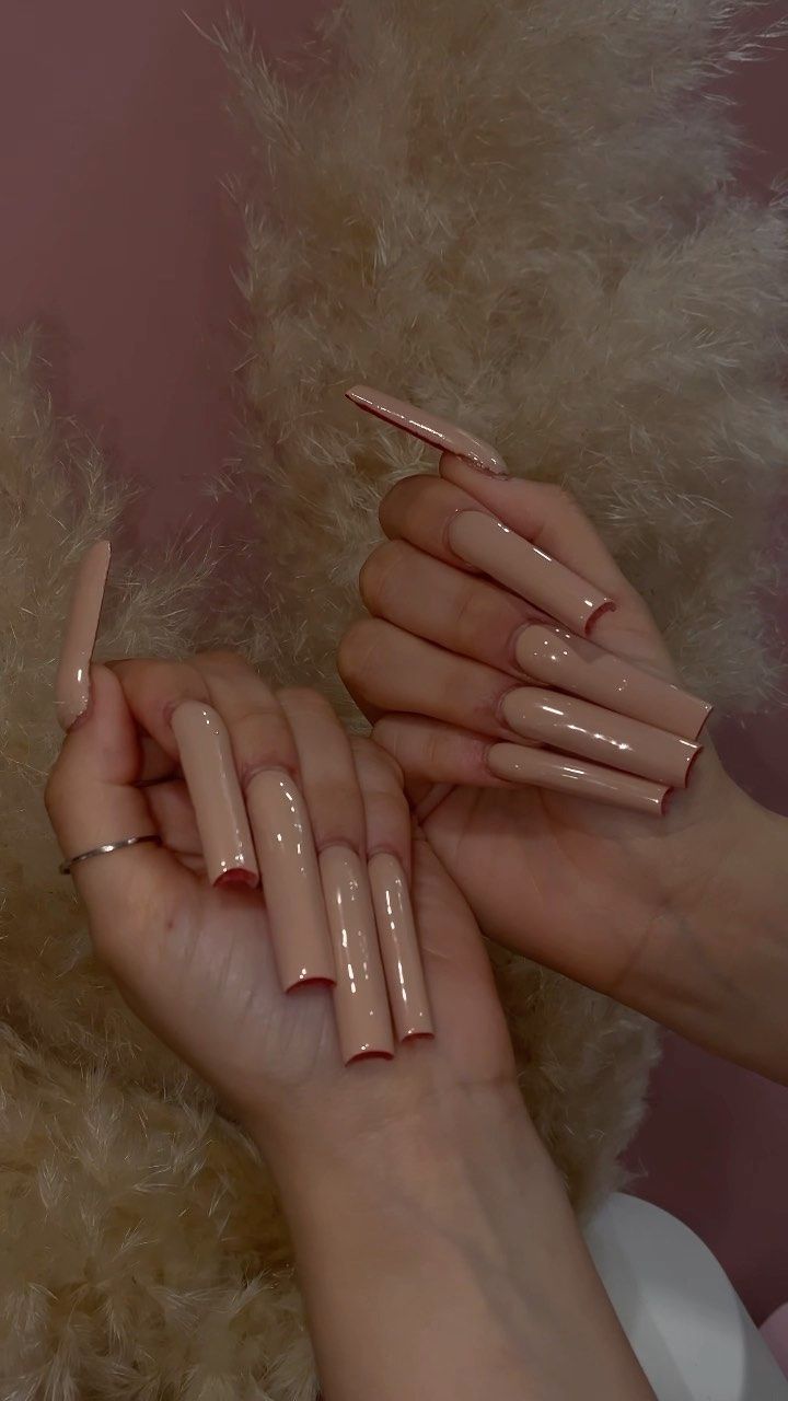 Elegant Glossy Nude Long Nails: A Chic Choice for Any Occasion.