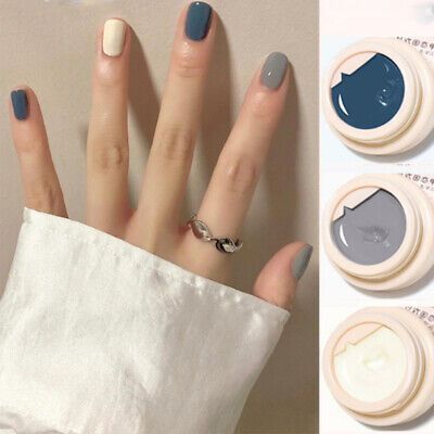 Trendy Nail Design: Modern Sophistication with Muted Tones and a Pop of Color.