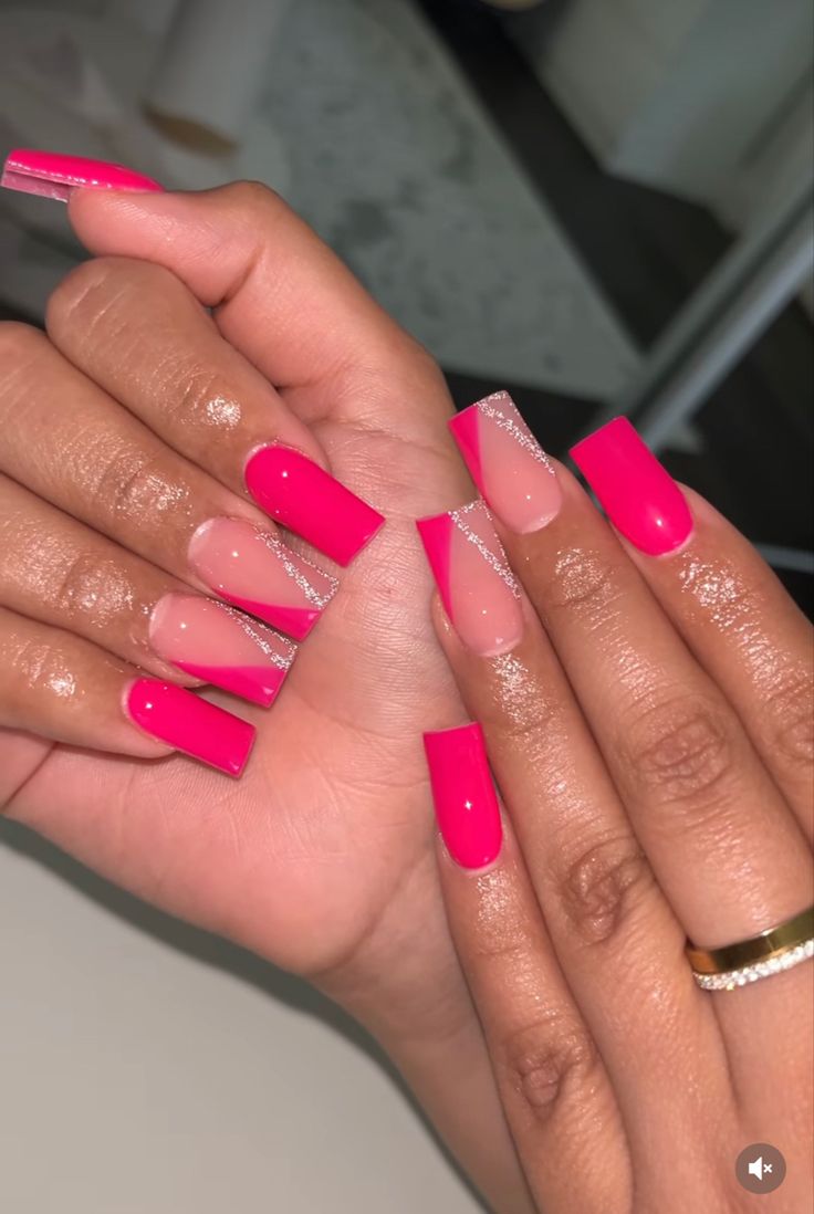 Chic Vibrant Pink Nail Design with Ombre, Clear Accents, and Glitter Lines.