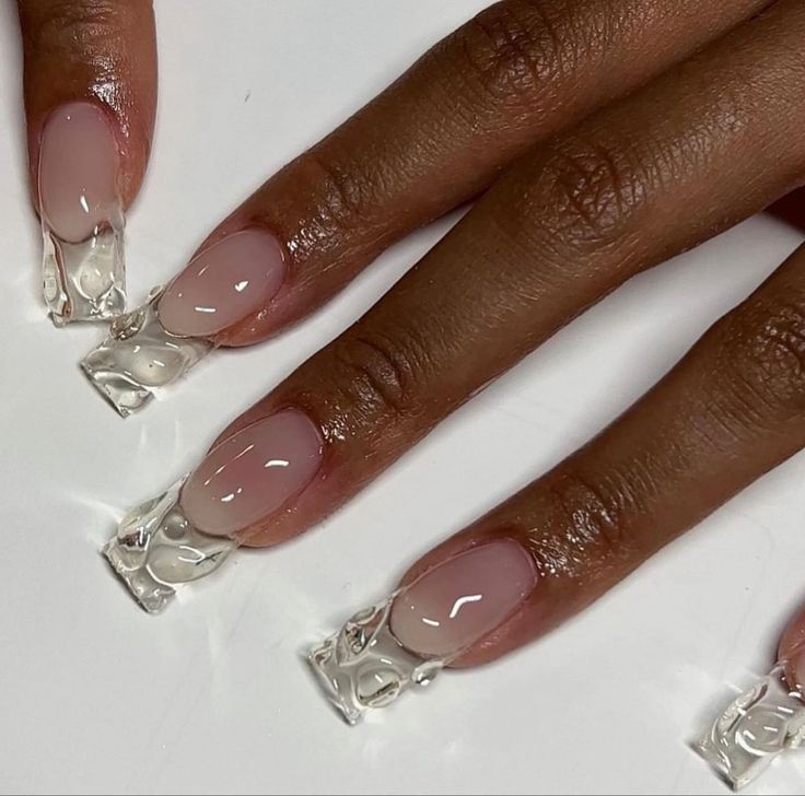 Modern Chic: Stylish Nude and Clear Nail Design with Glossy Rectangular French Tips.