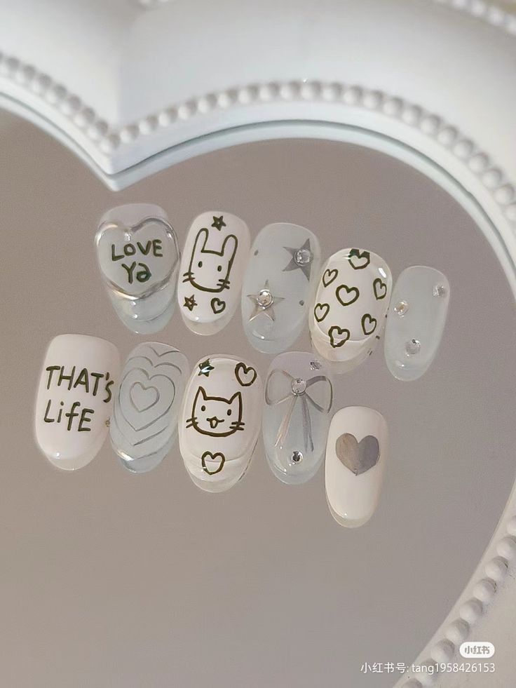 Whimsical Pastel Nail Art Featuring Charming Illustrations and Playful Motifs.