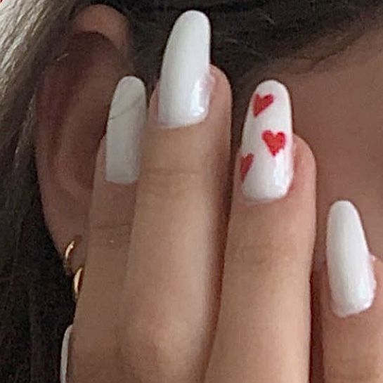 Chic White Nails with Playful Red Hearts: A Whimsical Expression of Love and Joy