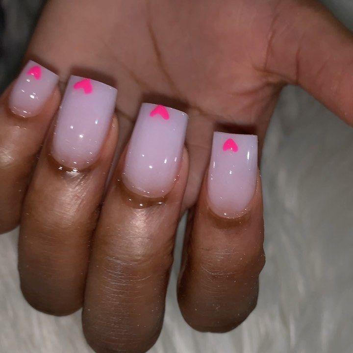 Trendy Chic Nail Design: Soft Pink Base with Glossy Finish and Neon Pink Heart Accents