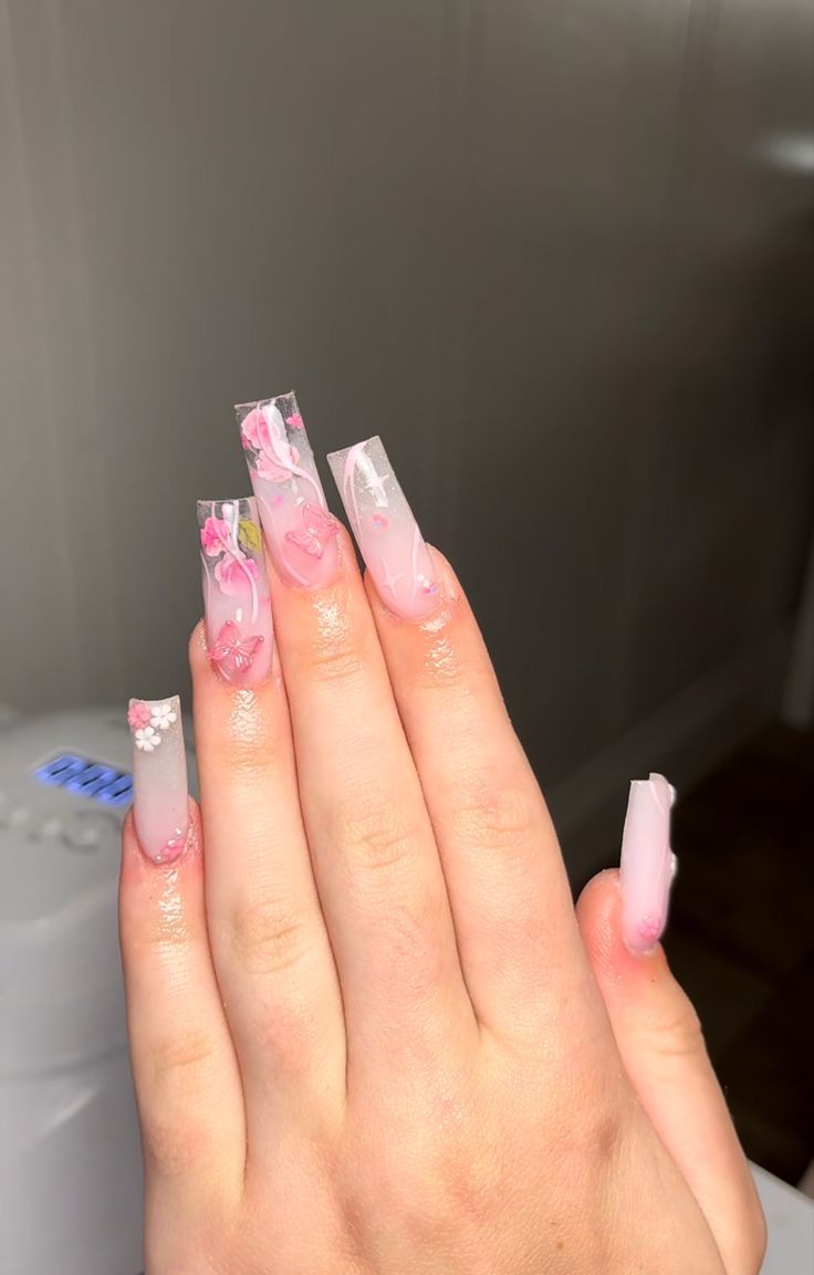 Elegant Soft Pink Floral Nail Design with Glossy Long Square Tips.