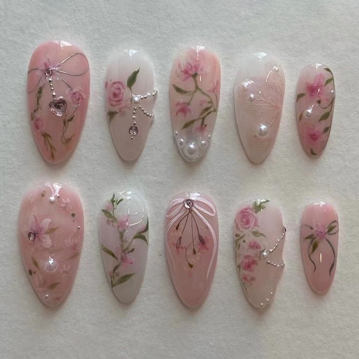 Elegant Floral Nail Design: Soft Pink Tones with Hand-Painted Roses and Pearls.