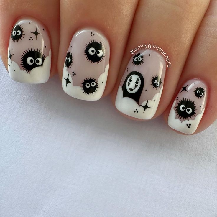 Playful Whimsical Nail Design with Black Characters and Soft Gradient Clouds for Halloween Fun.