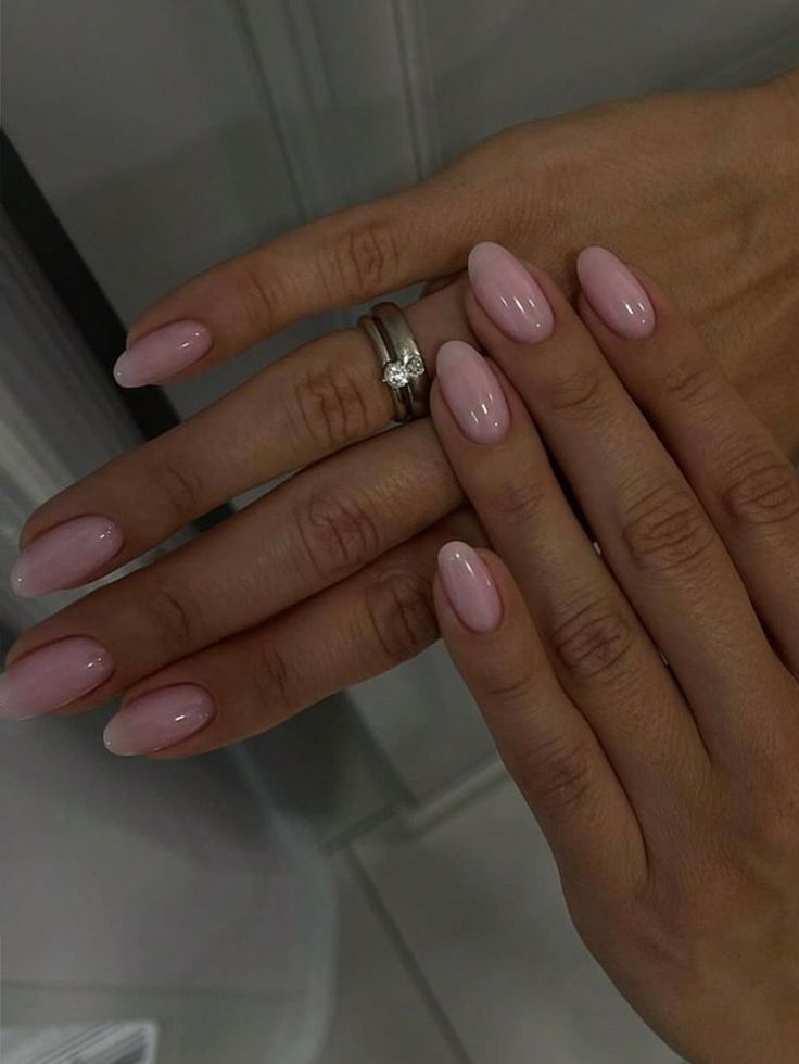 Elegant Soft Pink Gradient Nude Nail Design with Almond Shape and Glossy Finish.