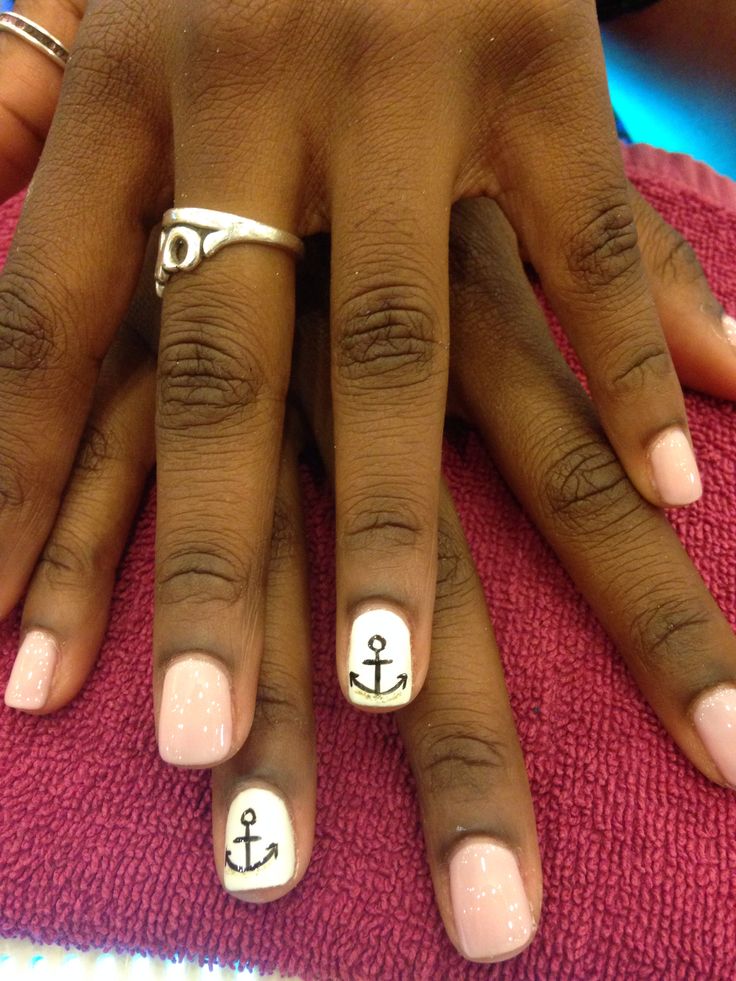 Chic Soft Pink Nail Design with Glossy Finish and Nautical Black Anchor Accents