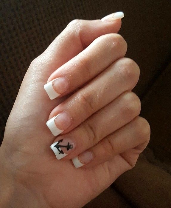 Chic French Manicure with Glossy White Tips and Nautical Anchor Accent