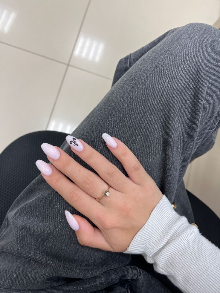 Chic Almond-Shaped Pastel Pink Nails with Ombre Effect and Minimalist Design