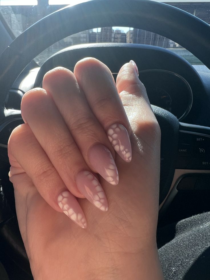 Chic Almond-Shaped Nails: Elegant Nude Base with Geometric White Accents