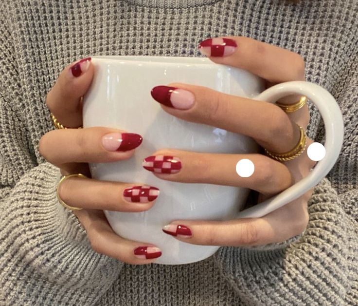 Chic Nail Design: Bold Red and Soft Nude with Unique Patterns for a Playful Aesthetic.