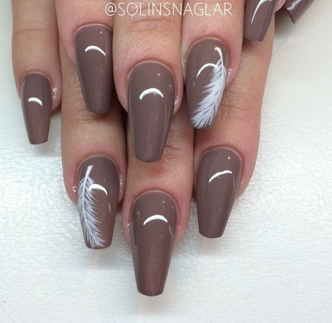 Sophisticated Brown Nail Design with Glossy Finish and Delicate White Feather Accents.