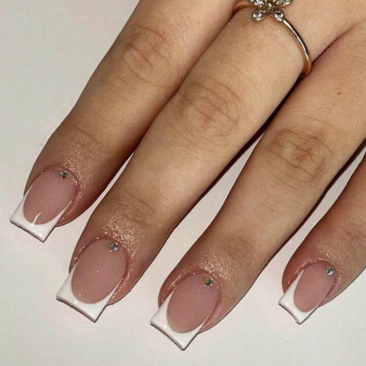 Elegant Modern French Manicure with Sparkling Rhinestones.