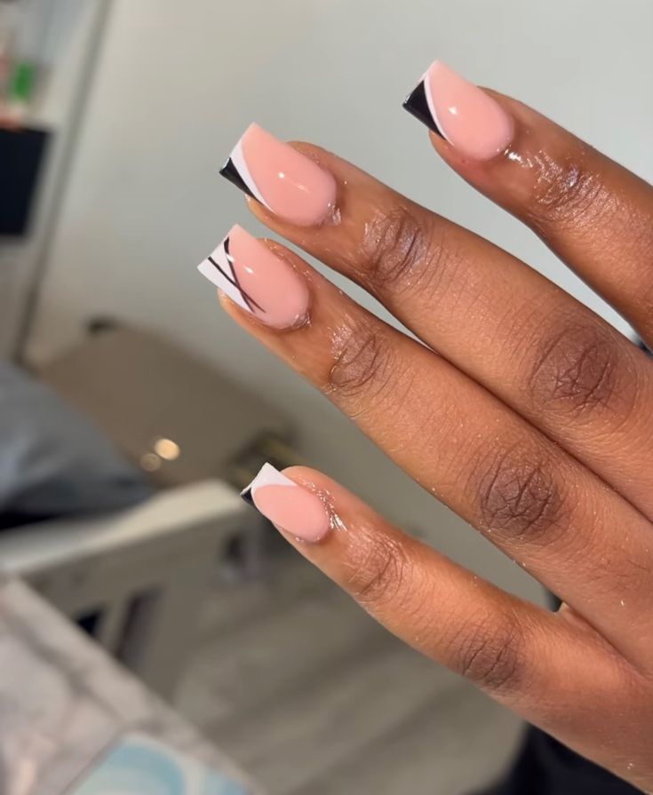 Elegant Nude Nail Design with Striking French Tips and Modern Lines